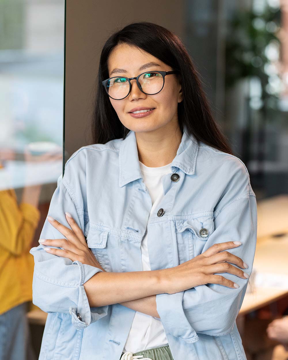 happy-young-asian-businesswoman-crossing-her-arms-JBXKPEN.jpg